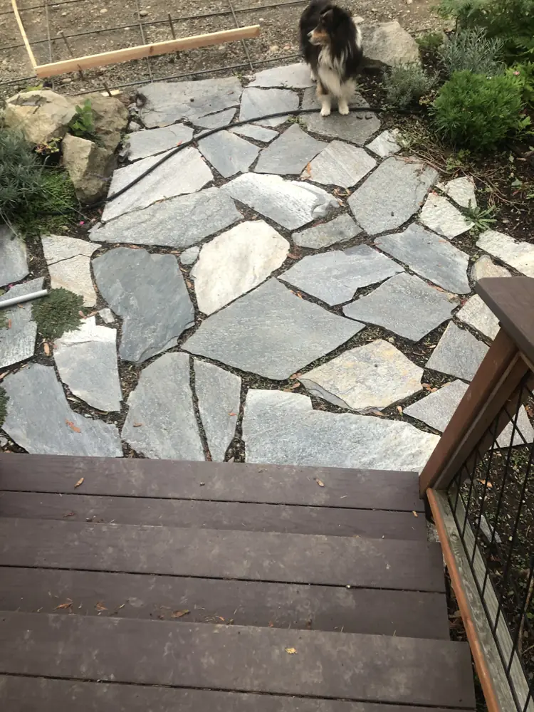 Flagstone landing below a deck